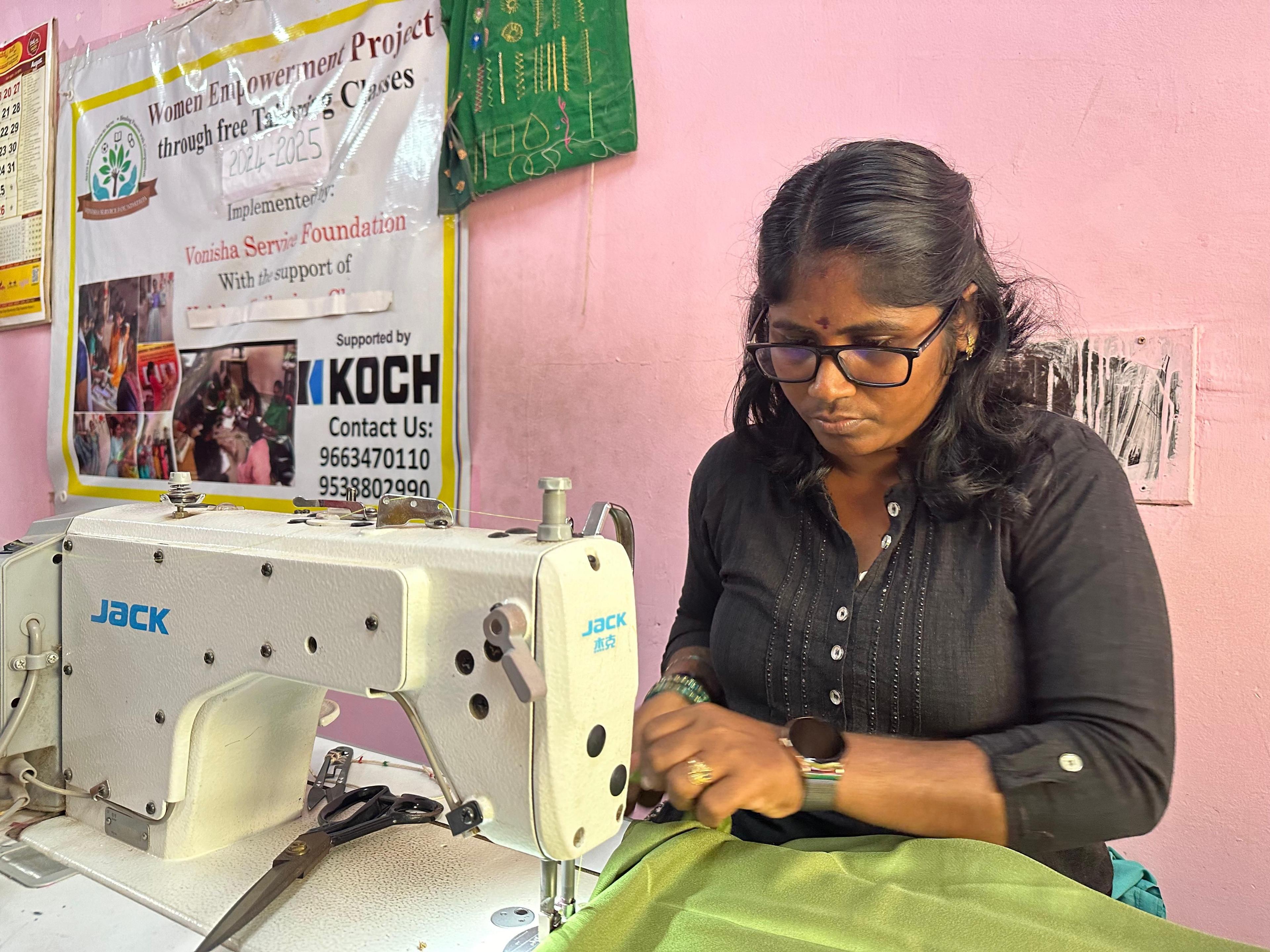 Woman using sewing machine